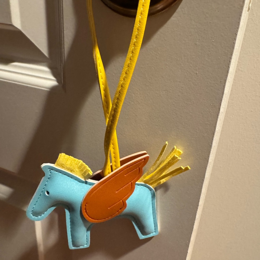 Sky Blue bag charm with Orange Wings
